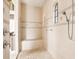 Shower room with a built-in seat, dual showerheads, and tiled walls at 9178 Panzani Pl, Windermere, FL 34786
