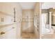 Shower room that offers dual showerheads, a window, and tiled walls at 9178 Panzani Pl, Windermere, FL 34786