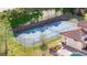 A private tennis court alongside a pool and home at 9178 Panzani Pl, Windermere, FL 34786