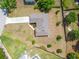 Overhead view of a single-Gathering home featuring a well-maintained lawn, spacious backyard, and a concrete driveway at 936 Dandridge Dr, Deltona, FL 32725