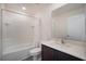 Clean bathroom features a shower/tub combination, single sink vanity, and tiled walls at 936 Dandridge Dr, Deltona, FL 32725