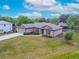 Attractive one-story home with a spacious front yard, a long driveway, and an attached two-car garage at 936 Dandridge Dr, Deltona, FL 32725