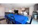 Open-concept living space with a dining area, kitchen island, and stainless steel appliances at 936 Dandridge Dr, Deltona, FL 32725