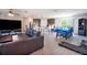 Open floor plan with living, dining, and kitchen area with stainless steel appliances at 936 Dandridge Dr, Deltona, FL 32725