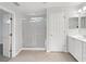 Bathroom featuring a tiled floor, a walk-in shower and white cabinets with a sink at 9665 Se 125Th Ln, Summerfield, FL 34491