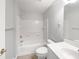 Clean white bathroom with a shower-tub combination and a modern sink at 9665 Se 125Th Ln, Summerfield, FL 34491