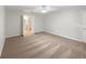 Bedroom with neutral walls and carpet featuring a ceiling fan and an ensuite bathroom at 9665 Se 125Th Ln, Summerfield, FL 34491