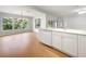 Bright kitchen with stainless appliances, modern island, and cozy dining area bathed in natural light at 9665 Se 125Th Ln, Summerfield, FL 34491