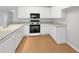 Modern kitchen features stainless steel appliances, granite countertops, and ample cabinet space, ideal for cooking at 9665 Se 125Th Ln, Summerfield, FL 34491