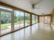 Light-filled sunroom features sliding glass doors offering outdoor views and access to the backyard at 9665 Se 125Th Ln, Summerfield, FL 34491