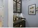 Stylish wet bar area with custom cabinetry, glassware display, and a convenient sink for entertaining at 1020 Mayfield Ave, Winter Park, FL 32789