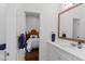 Bathroom featuring a white vanity and a door to the bedroom at 1020 Mayfield Ave, Winter Park, FL 32789