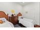 Bedroom features two beds, hardwood floors, and closet at 1020 Mayfield Ave, Winter Park, FL 32789