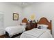 Cozy bedroom with two beds, hardwood floors, and closet at 1020 Mayfield Ave, Winter Park, FL 32789