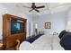 Comfortable main bedroom showcases a tv cabinet and decorative chair at 1020 Mayfield Ave, Winter Park, FL 32789