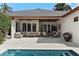 Outdoor patio with comfortable seating, ceiling fans, and a view of the pool and backyard at 1020 Mayfield Ave, Winter Park, FL 32789