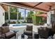 Outdoor patio space with comfortable seating areas, potted plants, and a view of the pool at 1020 Mayfield Ave, Winter Park, FL 32789