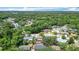Wide aerial shot showing a neighborhood surrounded by the greenery of mature trees at 1025 Winter Springs Blvd, Winter Springs, FL 32708