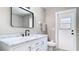 Modern bathroom featuring stylish vanity with marble countertop, sleek fixtures, and a well-lit mirror at 1025 Winter Springs Blvd, Winter Springs, FL 32708