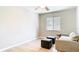 Bright bedroom with a window and modern furniture with hardwood floors creates a cozy atmosphere at 1025 Winter Springs Blvd, Winter Springs, FL 32708