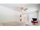Inviting bedroom features wood floors, a ceiling fan, access to closets and is filled with natural light at 1025 Winter Springs Blvd, Winter Springs, FL 32708