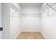 Spacious walk-in closet with wooden floors and white wire shelving providing ample storage space at 1025 Winter Springs Blvd, Winter Springs, FL 32708