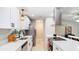 Bright kitchen featuring stainless steel appliances, white cabinets, and quartz countertops at 1025 Winter Springs Blvd, Winter Springs, FL 32708