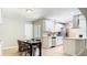 Bright, remodeled kitchen with modern stainless steel appliances, white cabinetry, and an adjacent dining area at 1025 Winter Springs Blvd, Winter Springs, FL 32708