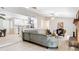Open-concept living room and kitchen with light wood floors and stainless appliances at 1025 Winter Springs Blvd, Winter Springs, FL 32708
