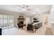 Spacious living room featuring light wood floors, brick fireplace, ceiling fans, and natural light at 1025 Winter Springs Blvd, Winter Springs, FL 32708