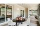 Covered patio featuring neutral walls, an area for dining, and sliding glass doors to the home's interior at 1025 Winter Springs Blvd, Winter Springs, FL 32708