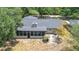 An aerial view of the home's rear featuring a screened-in patio and private backyard at 1025 Winter Springs Blvd, Winter Springs, FL 32708