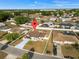 Aerial view of a single-Gathering home highlighting the property lines, driveway, and neighborhood at 1065 Jason Ridge Ct, Kissimmee, FL 34747