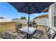 Outdoor patio area featuring a table set, grill, and a spacious fenced-in yard perfect for entertaining at 1065 Jason Ridge Ct, Kissimmee, FL 34747