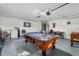 Game room features a pool table and foosball table at 1065 Jason Ridge Ct, Kissimmee, FL 34747