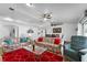 Spacious living room with bright decor, ceiling fan, and wood flooring throughout at 1065 Jason Ridge Ct, Kissimmee, FL 34747