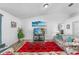 Living room with wood floors and a view of the eat-in kitchen at 1065 Jason Ridge Ct, Kissimmee, FL 34747