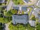 Aerial view of the property showcasing the back patio, the roof, and the surrounding neighborhood at 1068 Lake Baldwin Ln, Orlando, FL 32814