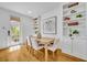 Bright dining area with built-in shelving, modern decor, and a wooden table set at 1068 Lake Baldwin Ln, Orlando, FL 32814