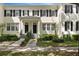 Well-maintained two-story townhome with black shutters, clean landscaping and an inviting entrance at 1068 Lake Baldwin Ln, Orlando, FL 32814