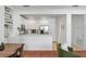 Open-concept kitchen with stainless steel appliances, tile floors, and a breakfast bar at 1068 Lake Baldwin Ln, Orlando, FL 32814