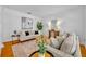 Cozy living room with comfortable seating, stylish decor, and a decorative area rug at 1068 Lake Baldwin Ln, Orlando, FL 32814