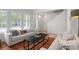 Bright living room with hardwood floors, neutral decor, and plenty of natural light at 1068 Lake Baldwin Ln, Orlando, FL 32814