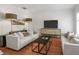 Comfortable living room with modern furnishings and a large flat-screen television at 1068 Lake Baldwin Ln, Orlando, FL 32814