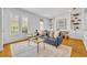 Inviting living room with built-in shelving and abundant natural light at 1068 Lake Baldwin Ln, Orlando, FL 32814