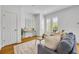 Stylish living room features hardwood floors and plantation shutter window coverings at 1068 Lake Baldwin Ln, Orlando, FL 32814