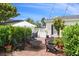 Charming brick patio featuring outdoor seating, lush landscaping, and a relaxing ambiance for entertaining at 1068 Lake Baldwin Ln, Orlando, FL 32814
