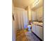 Well-lit bathroom featuring a vanity, mirror, toilet, and shower with curtain at 107 Vista Verdi Cir # 237, Lake Mary, FL 32746
