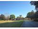 A well maintained exterior view of a two story building on a large lush green property with manicured landscape at 107 Vista Verdi Cir # 237, Lake Mary, FL 32746