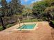 Outdoor hot tub framed by brick pavers and lush landscaping at 107 Vista Verdi Cir # 237, Lake Mary, FL 32746